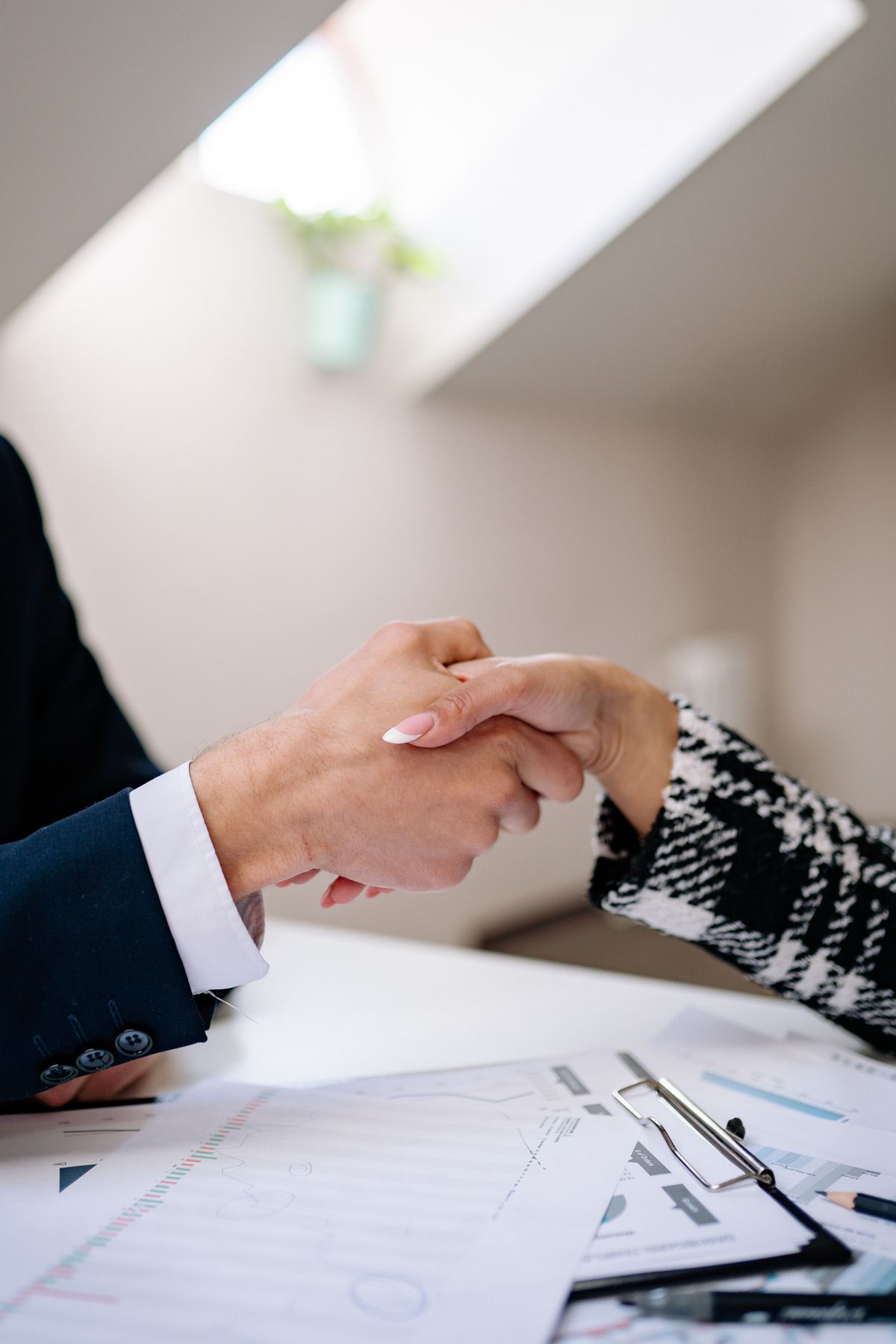 Advocate and client shaking hands after a consultation