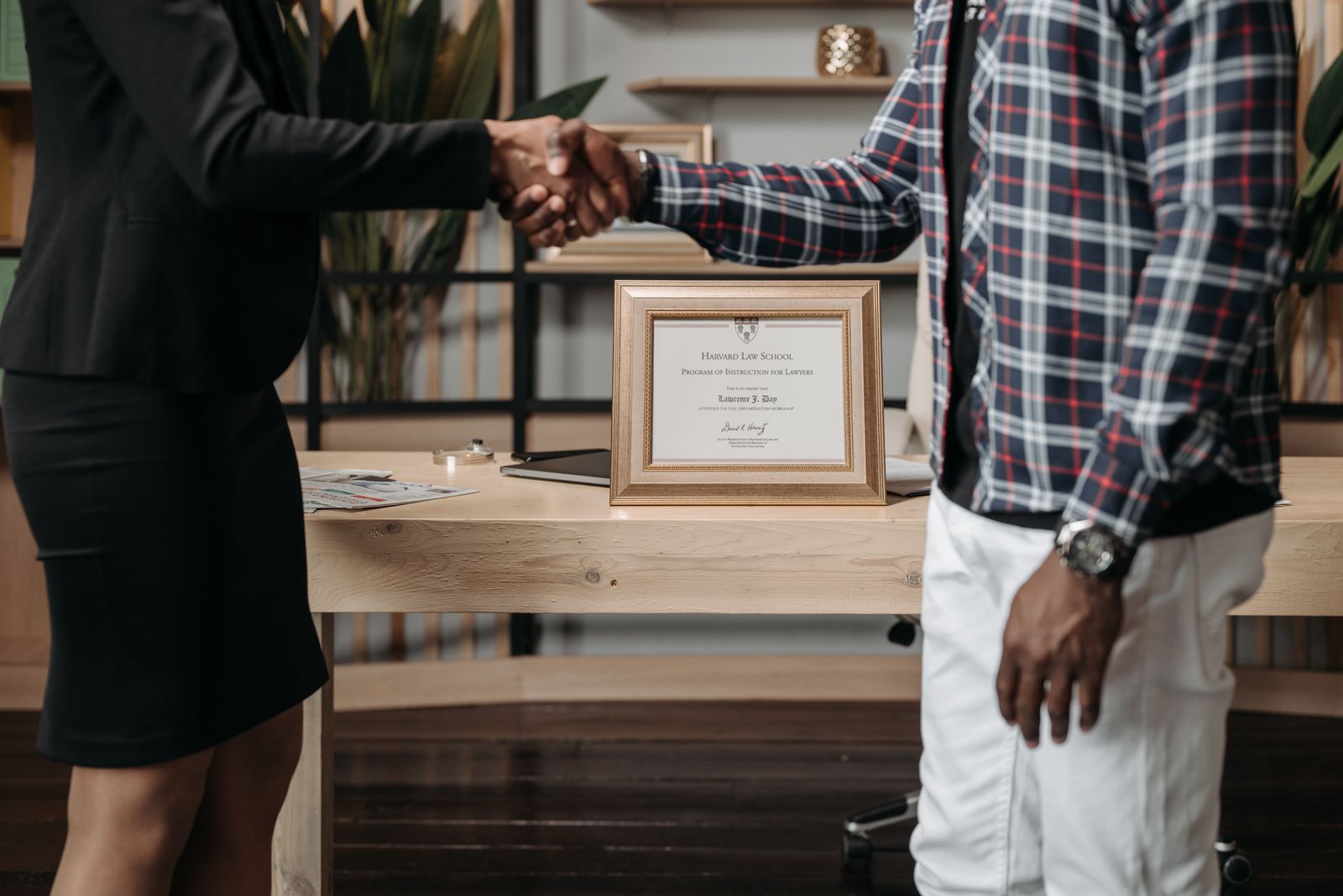 Advocate and client shaking hands